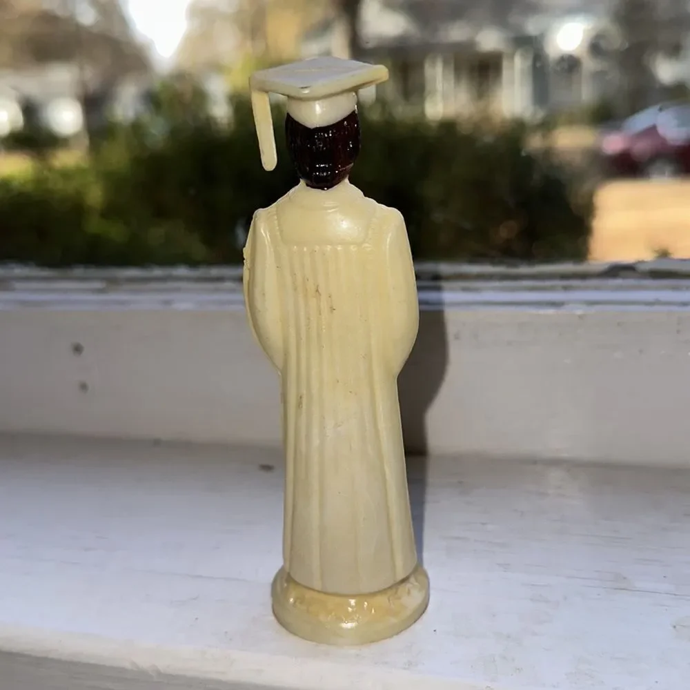 Vintage thin hard plastic‎ female graduate holding diploma cake topper